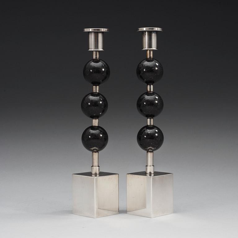 A pair of Sigurd Persson silver plated and porphyry candlesticks, Sweden.