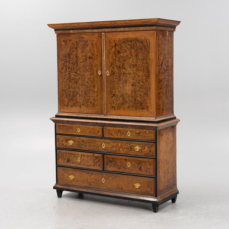 A burr alder, elm, and gilt-brass mounted late Baroque cabinet, first part of the 18th century.