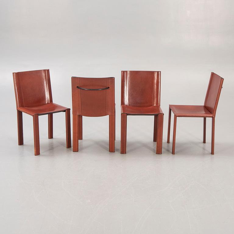A set of four Matteo Grassi leather chairs alter part of the 20th century.