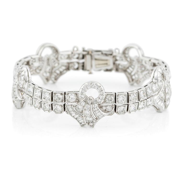 A platinum bracelet with round brilliant-, eight- and baguette-cut diamonds, Gübelin, founded in 1854.