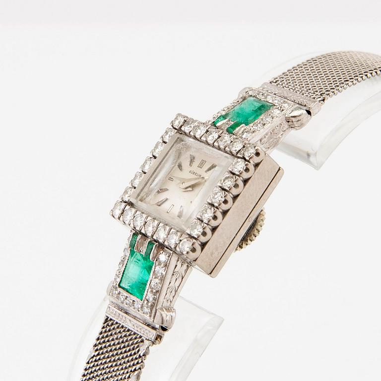 Gübelin bracelet watch in 950 platinum with round brilliant-cut and single-cut diamonds as well as step-cut emeralds.