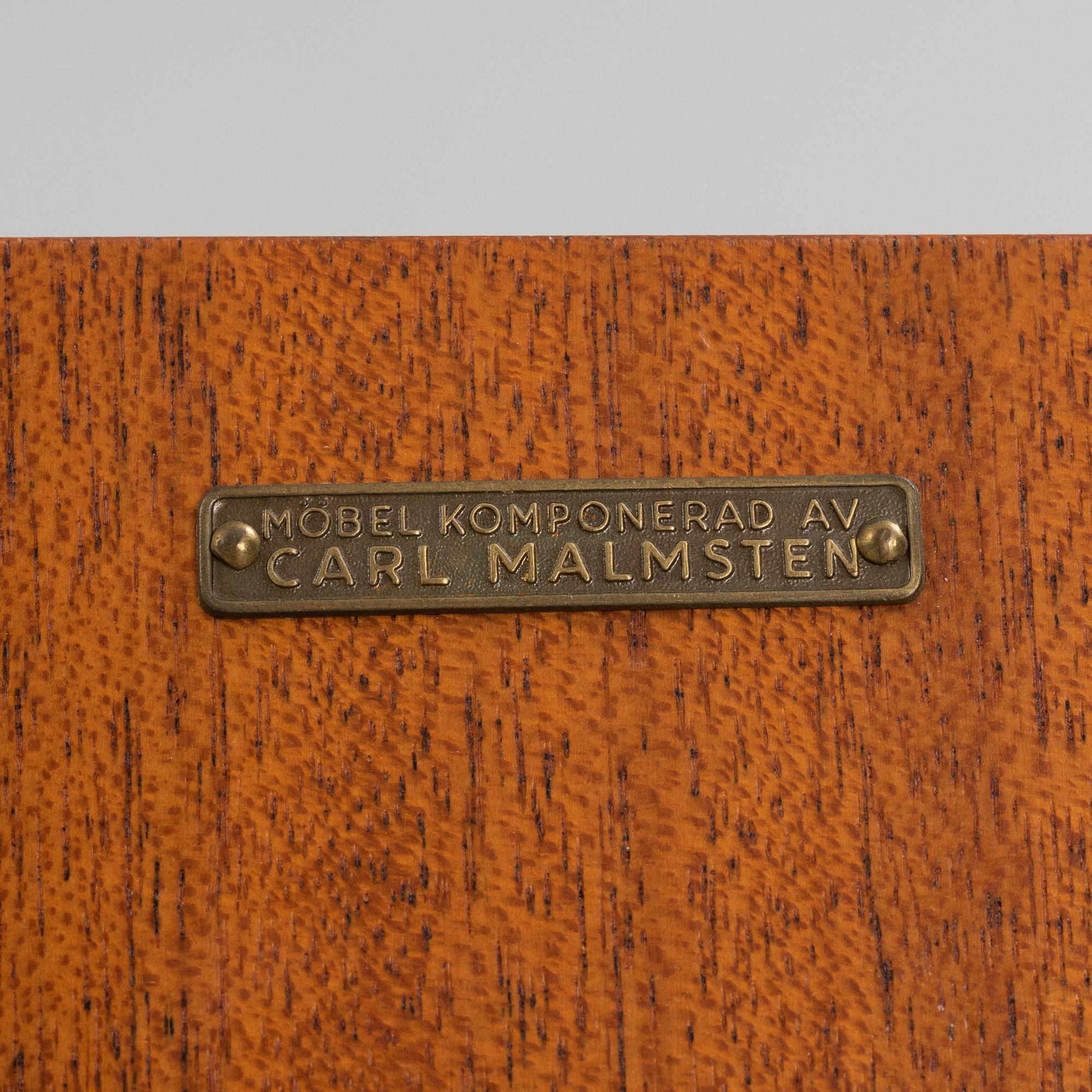 Carl Malmsten, a 'Mittens Rike' mahogany veneered cabinet, Åfors Möbelfabrik, Blomstermåla, dated 1957.