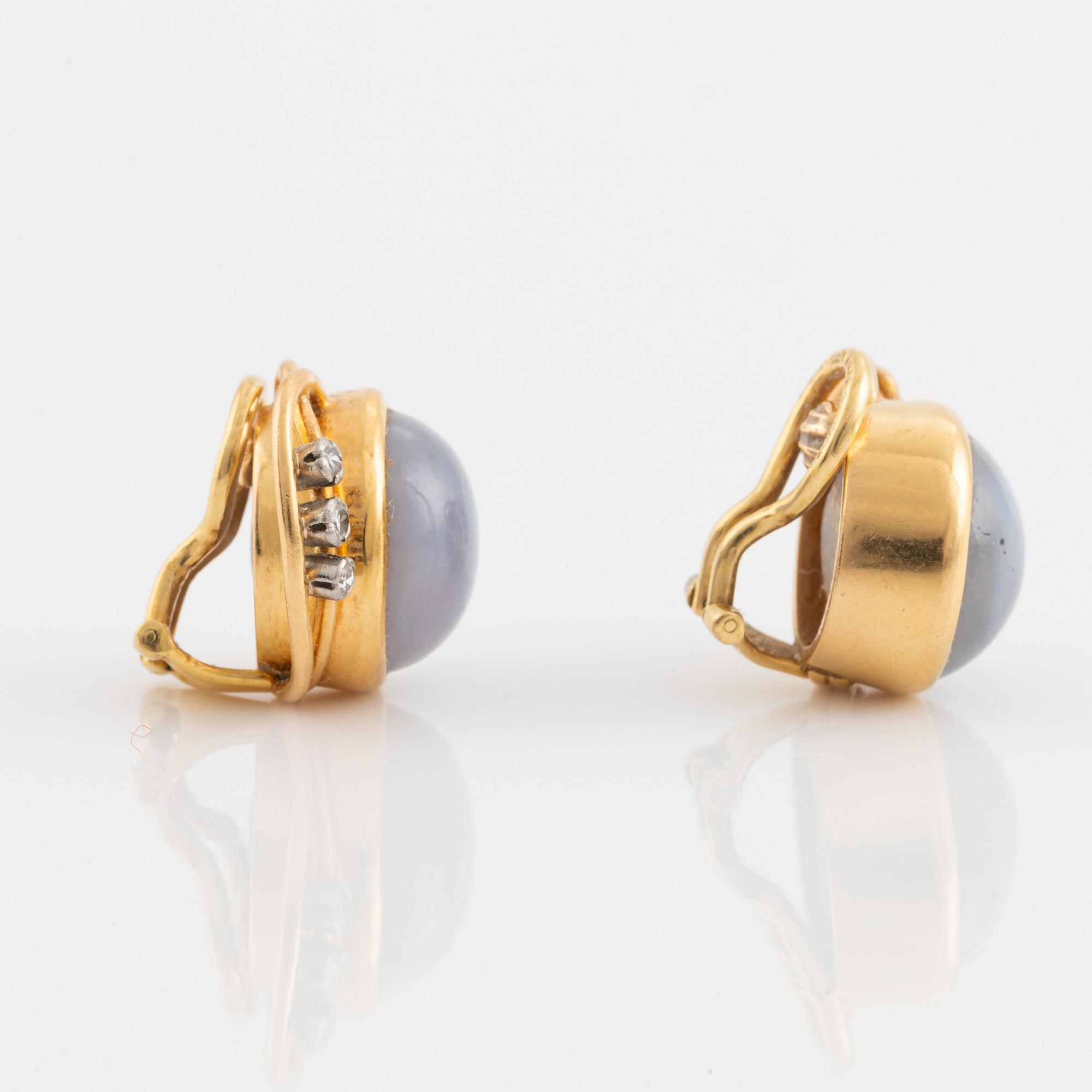 Gold with star sapphire and small diamond clip earrings, A. Tillander.