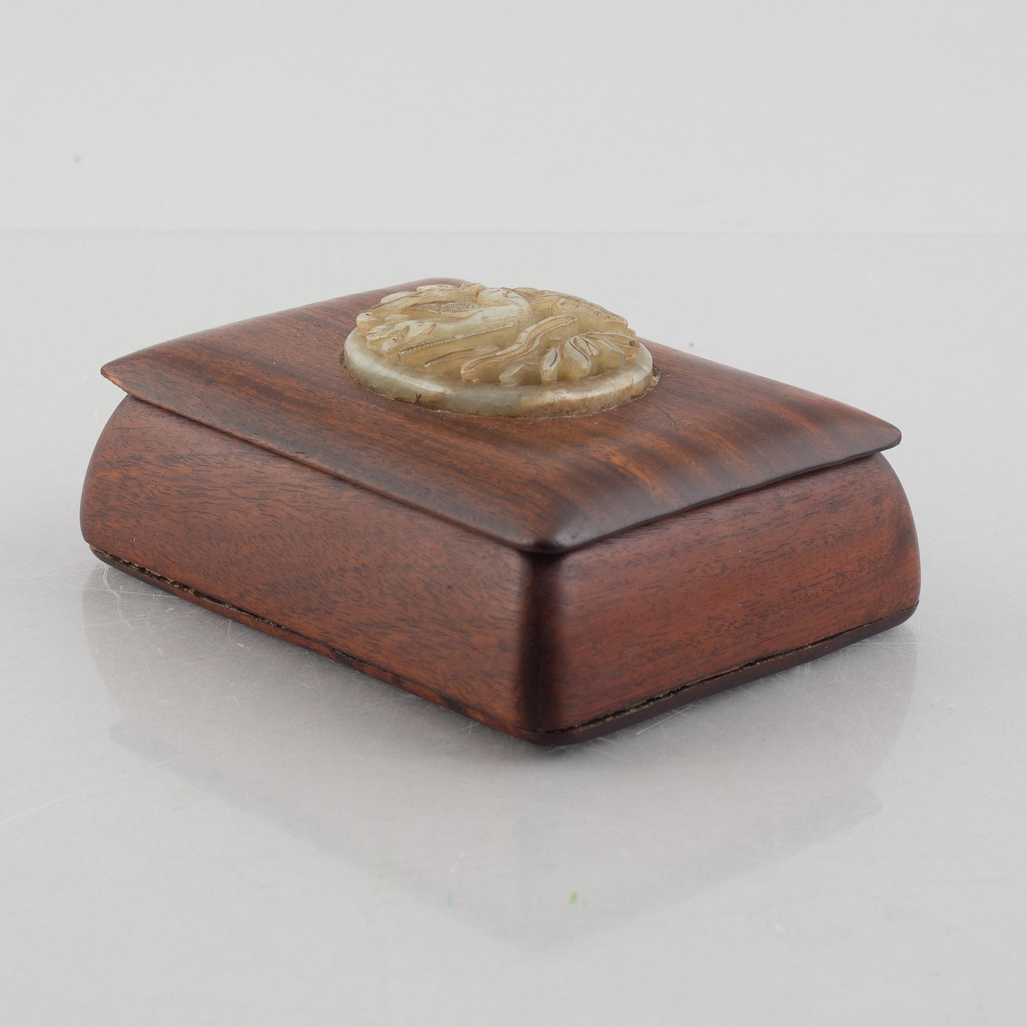 Two Chinese hardwood boxes with nephrite plaques, 20th century.