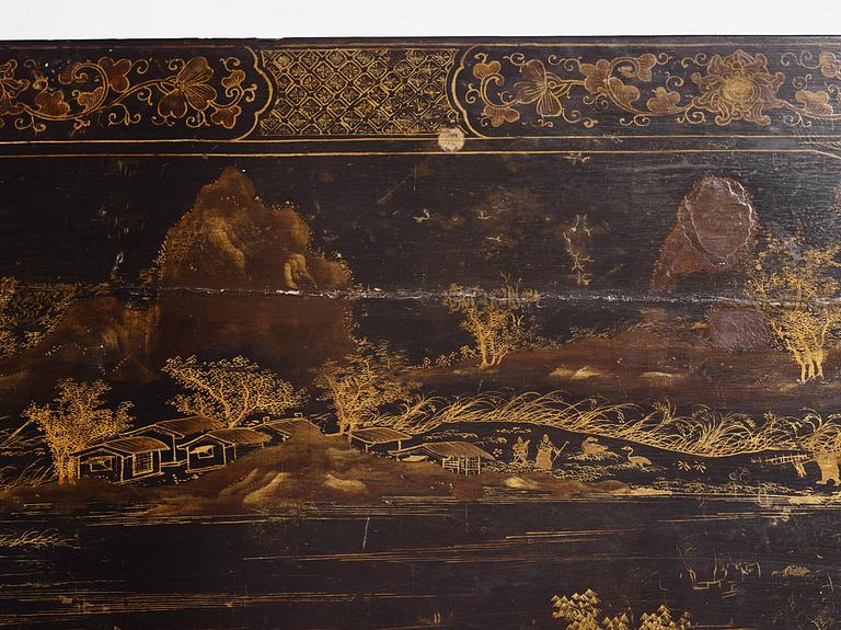 A Chinese painted black lacquer low table, Qing dynasty.