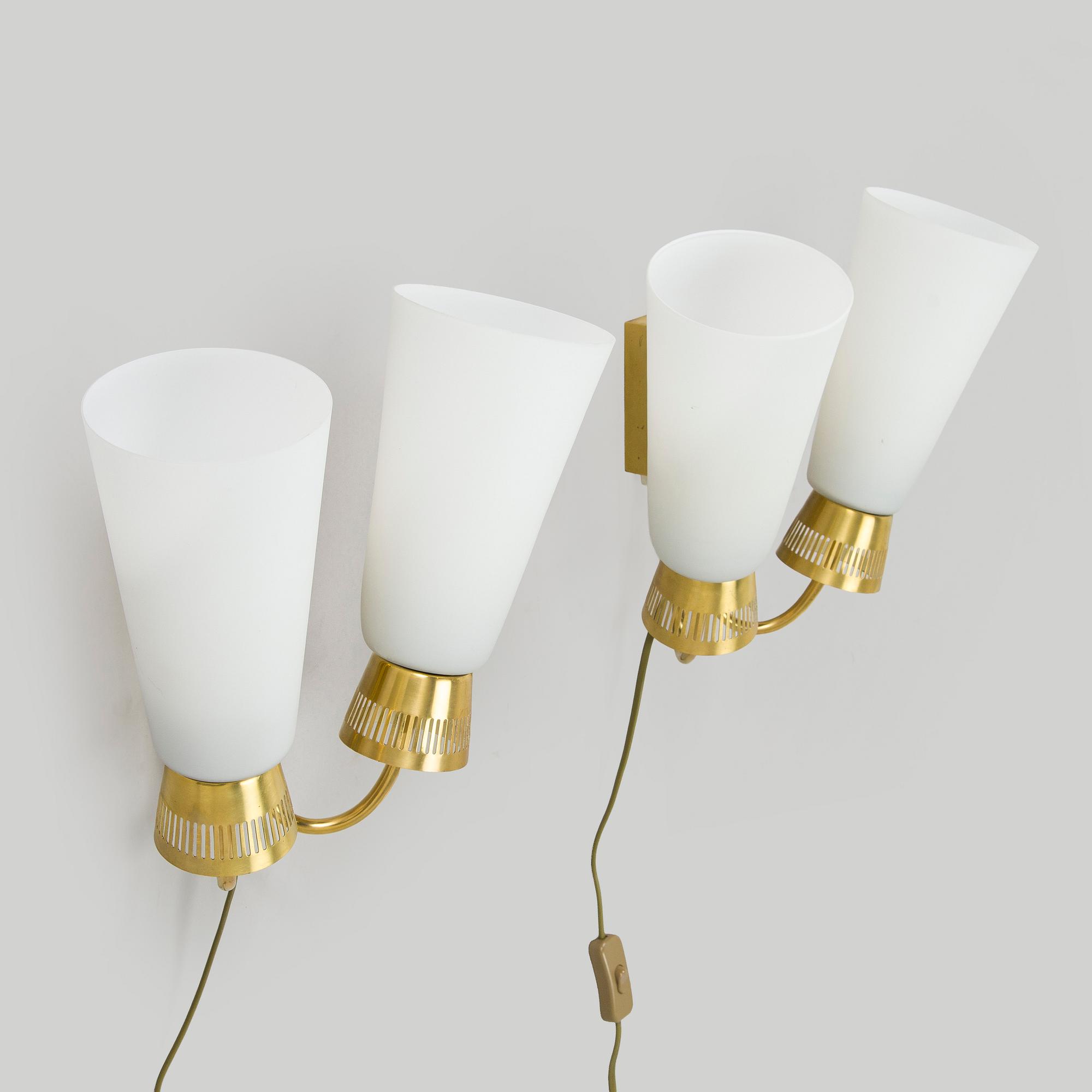 A pair of mid-20th century wall lights, model EY60, Itsu, Finland.