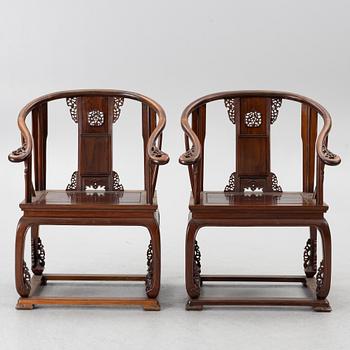 A pair of Chinese horseshoe-back hardwood armchairs, 1900s.