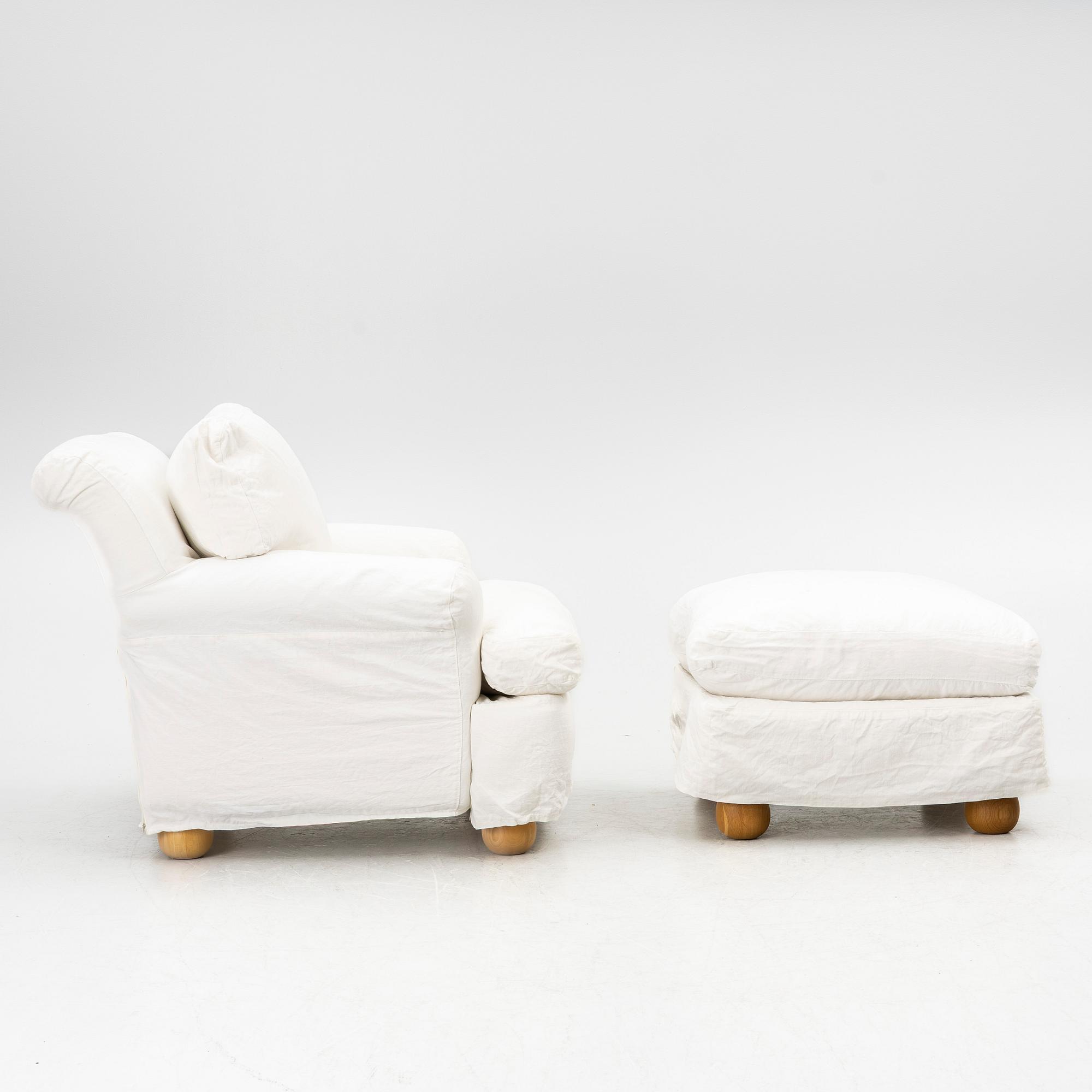 An armchair with ottoman, contemporary.