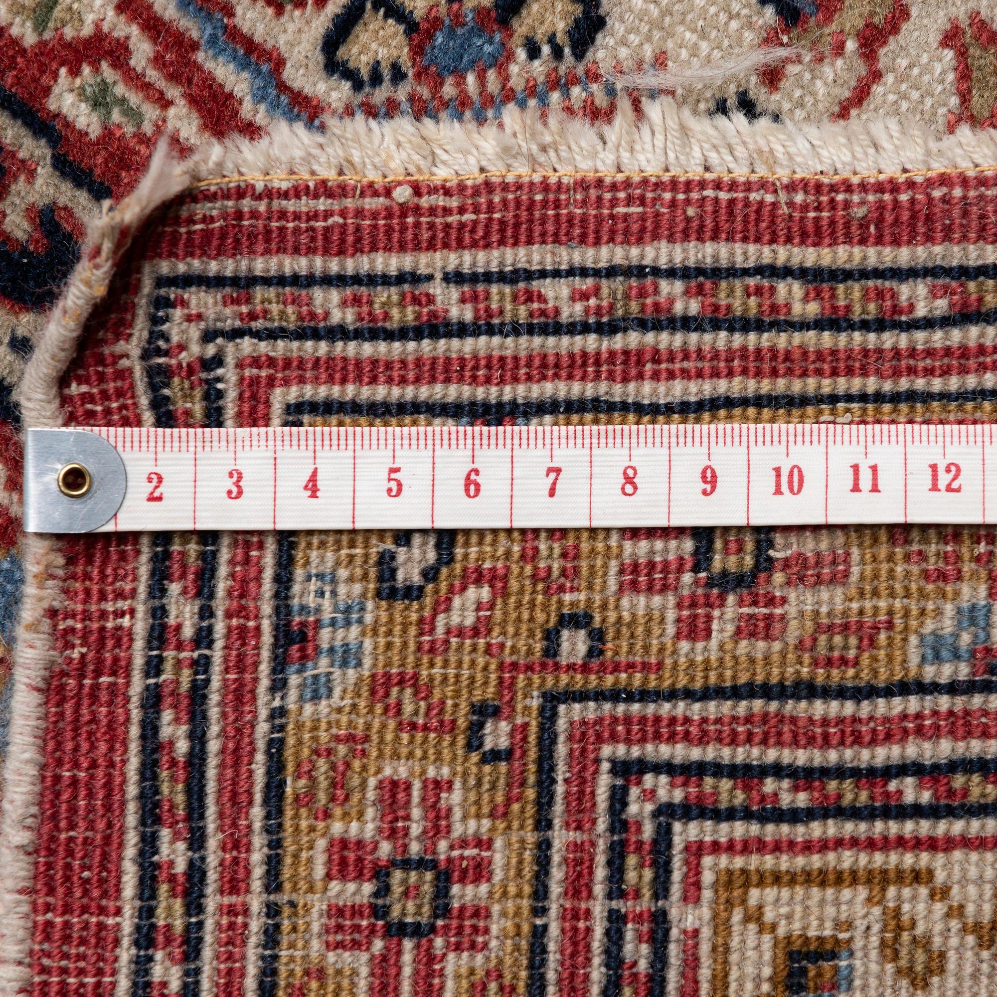 A semi-antique Hereke carpet, Western Turkey, c. 685 x 489 cm.