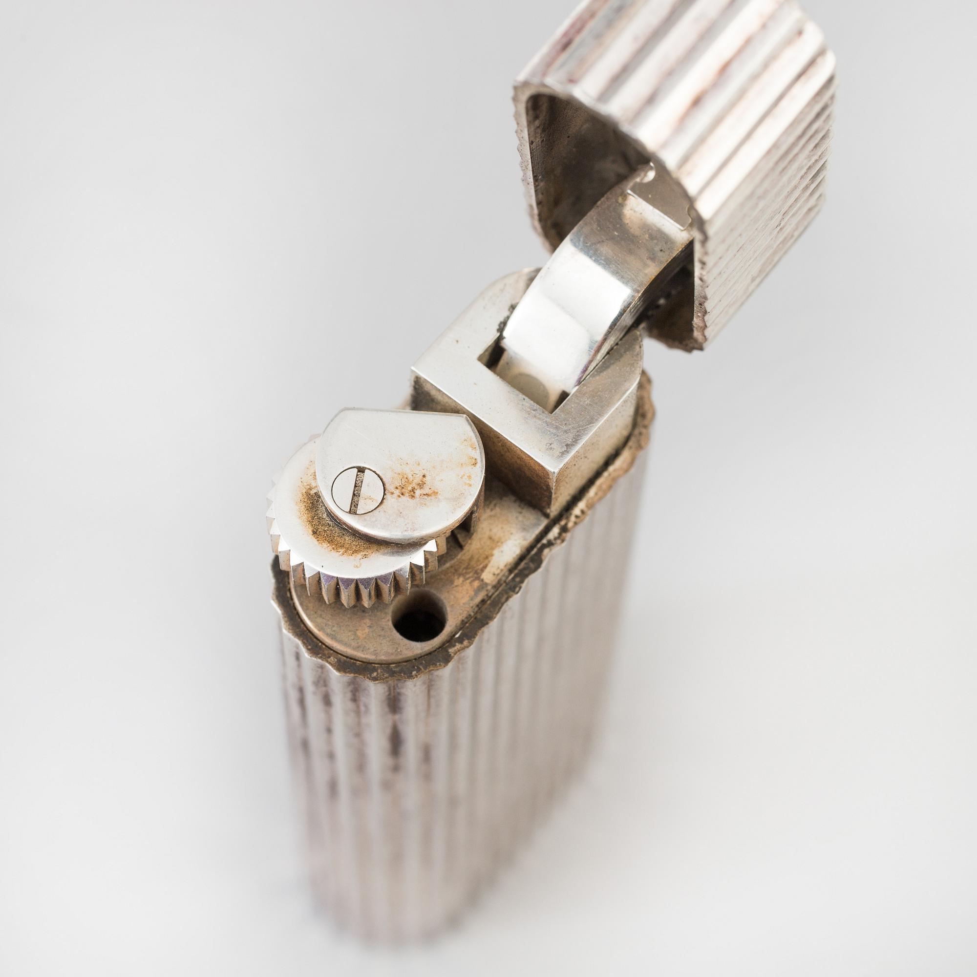 a 20th century Cartier lighter with original box from Paris.