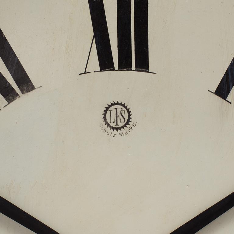 A 19th century wall clock marked LFS Schutz Marke, Germany.