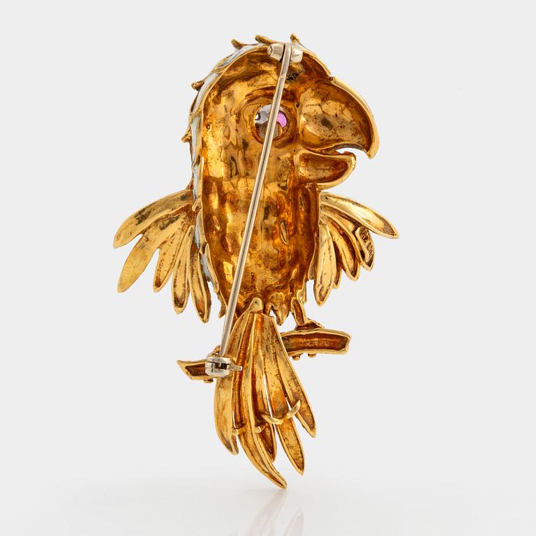 An 18K gold and enamel brooch set with eight-cut diamonds and a ruby.