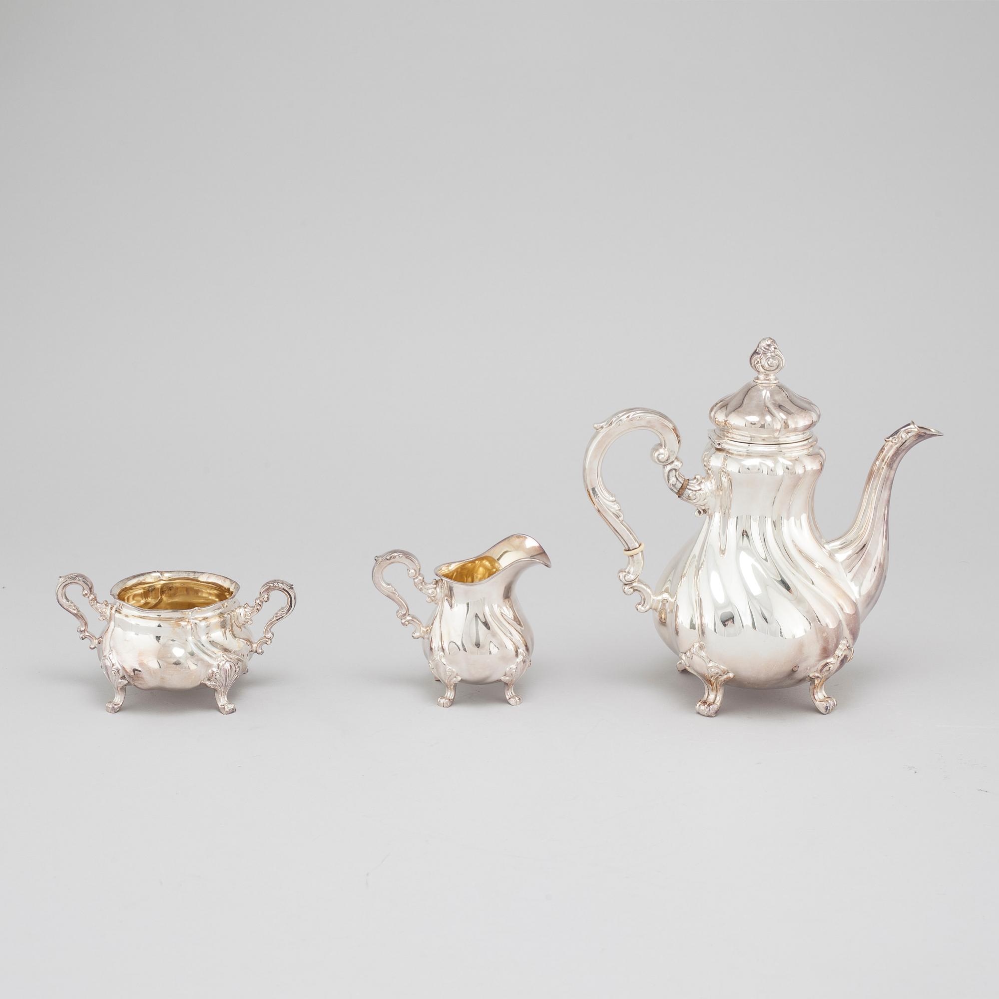 A silver coffee pot, creamer and sugar bowl with swedish import marks, 1930s.