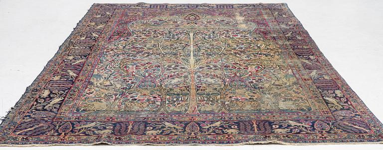 A semi-antique Kerman carpet, c. 325 x 203 cm.