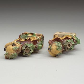 A pair of bisquit joss stick holders in the shape of buddhist lions, Qing dynasty, Kangxi (1662-1722).