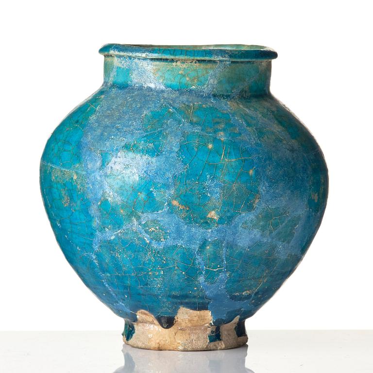 A turquoise Keshan pottery vase, central Persia, 13th century.