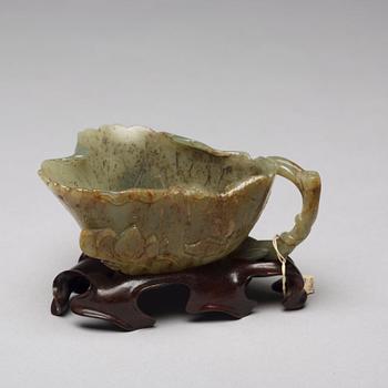 A Chinese group of three sculptured cups.