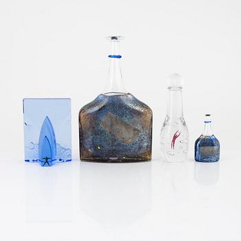 Bertil Vallien, four glass objects, Kosta Boda, Sweden, signed.