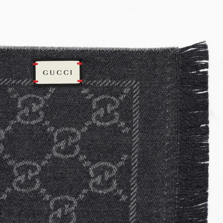 Gucci, a wool 'GG Jaquard Knitted Scarf'.