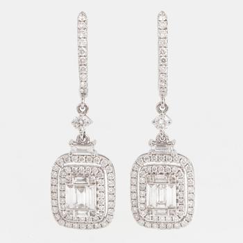 A pair of baguette and brilliant-cut diamond earrings.