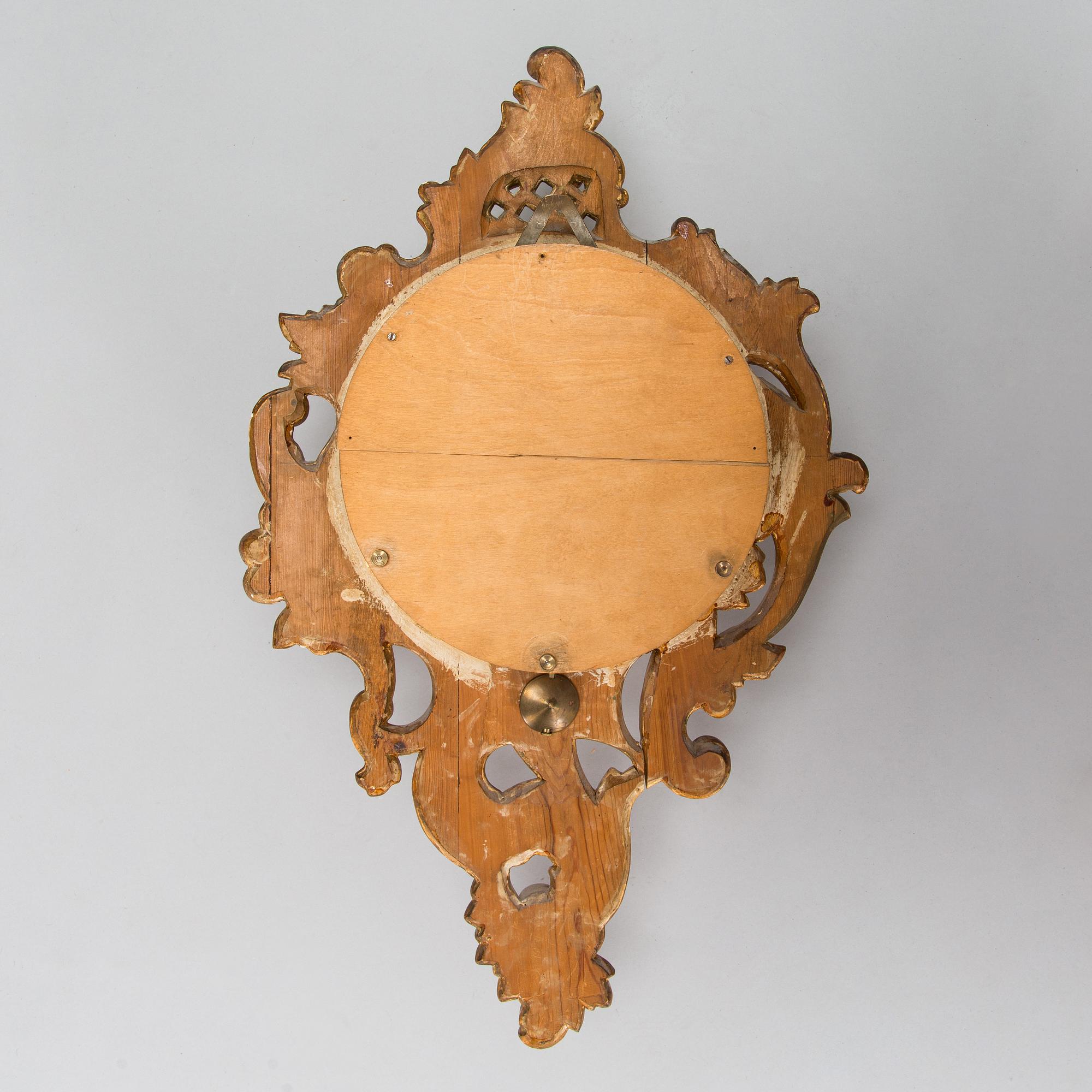 A Rococo style wall clock from first half of the 20th century.