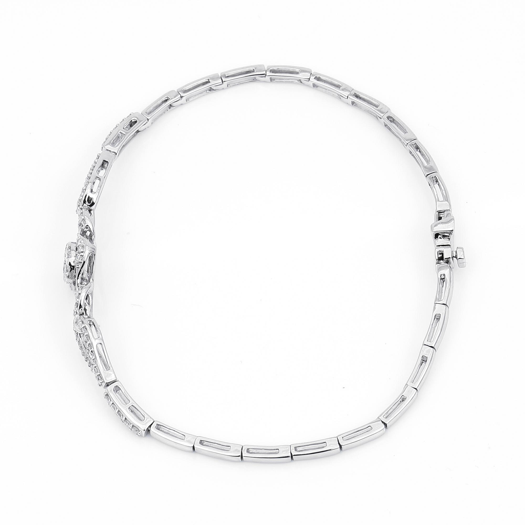 ARMBAND, 14K vitguld med runda och briljantslipade diamanter, tot ca 0,72 ct. Vikt ca 7,27 g.