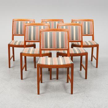 BERTIL FRIDHAGEN, a seven  piece walnut dining suite from Bodafors.