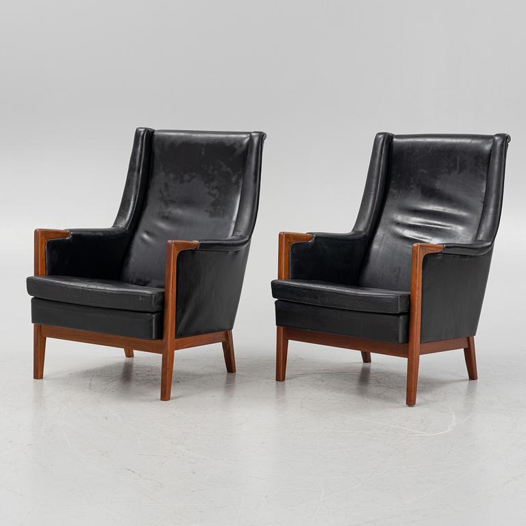 Karl Erik Ekselius, a pair of leather armchairs, JOC, Vetlanda, Sweden, 1960's.