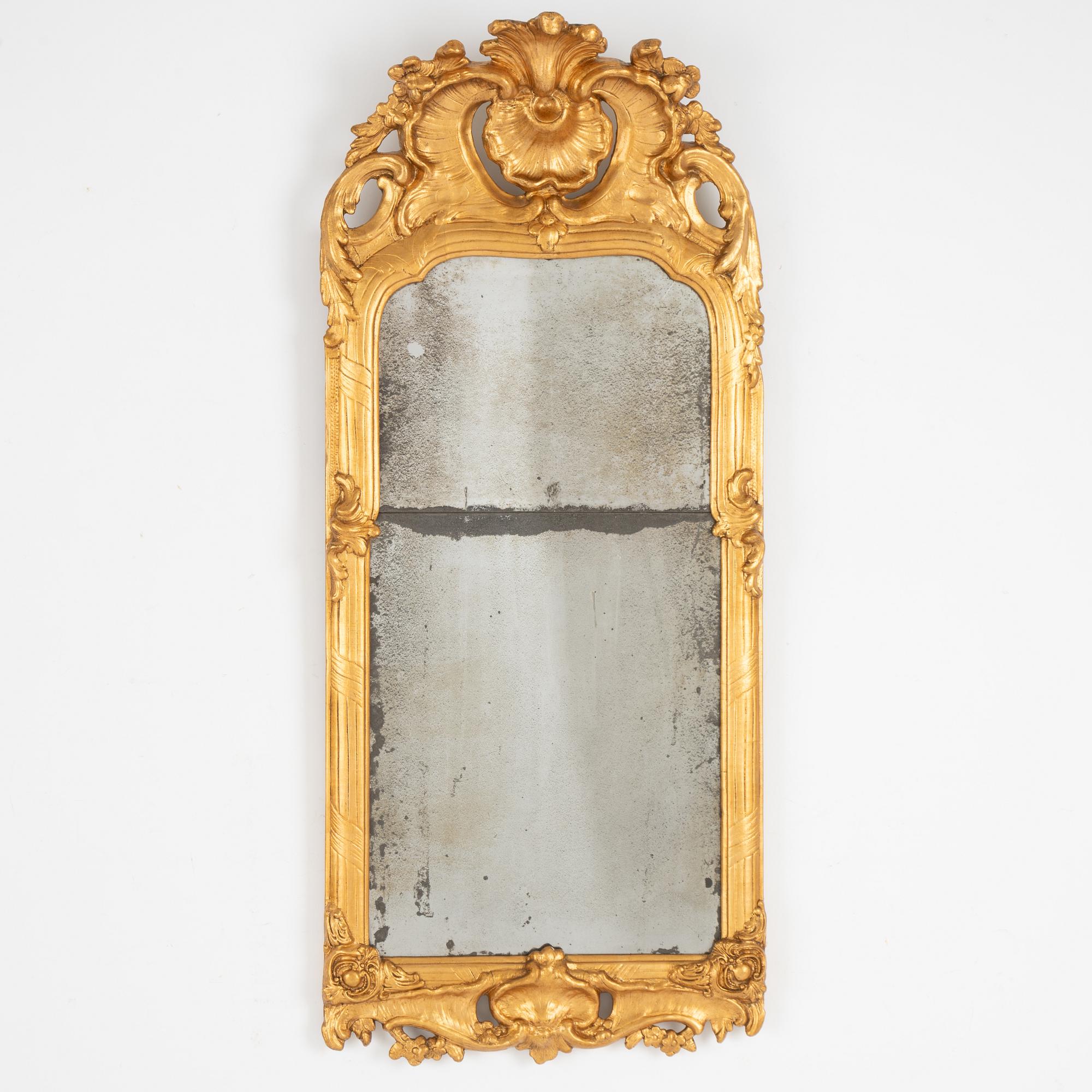 A Rococo mirror, later part of the 18th century.