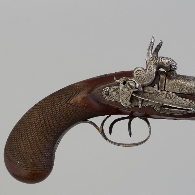 A 19th century double barreled percussion pistol.