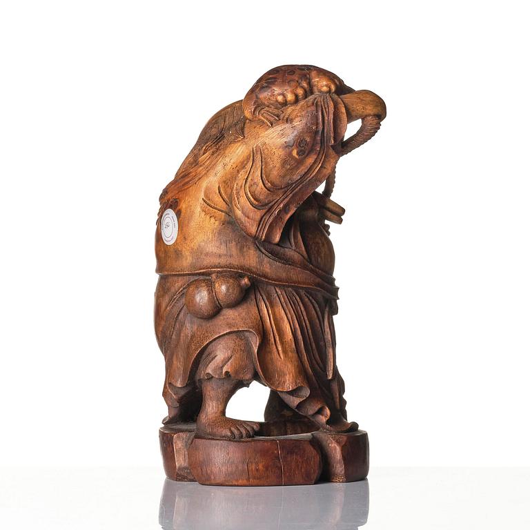 A carved bamboo sculpture of Liu Hai and his golden toad, Qing dynasty, 18th/19th century.