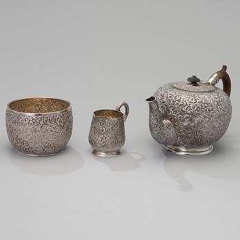 A three-piece Persian silver set for tea.