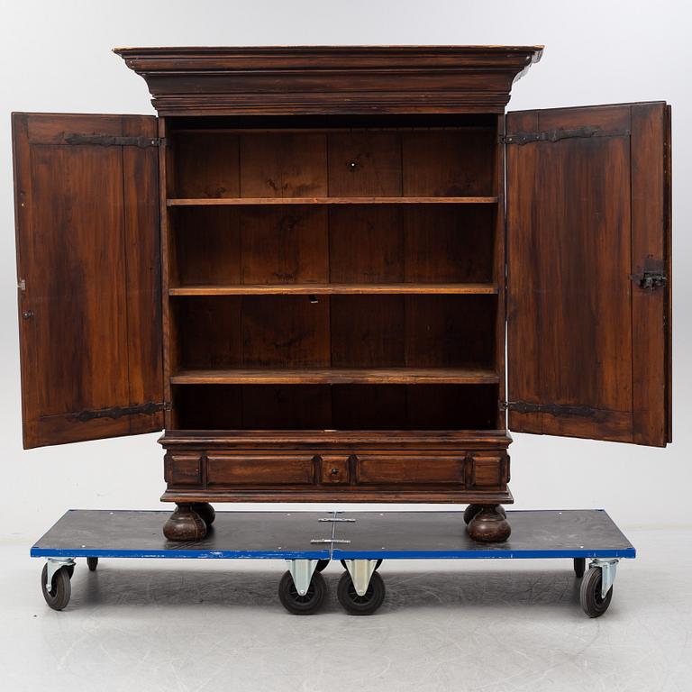 A first half of the 18th Century Baroque stained pine cabinet.