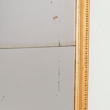 An Empire mirror, first half of the 19th century.