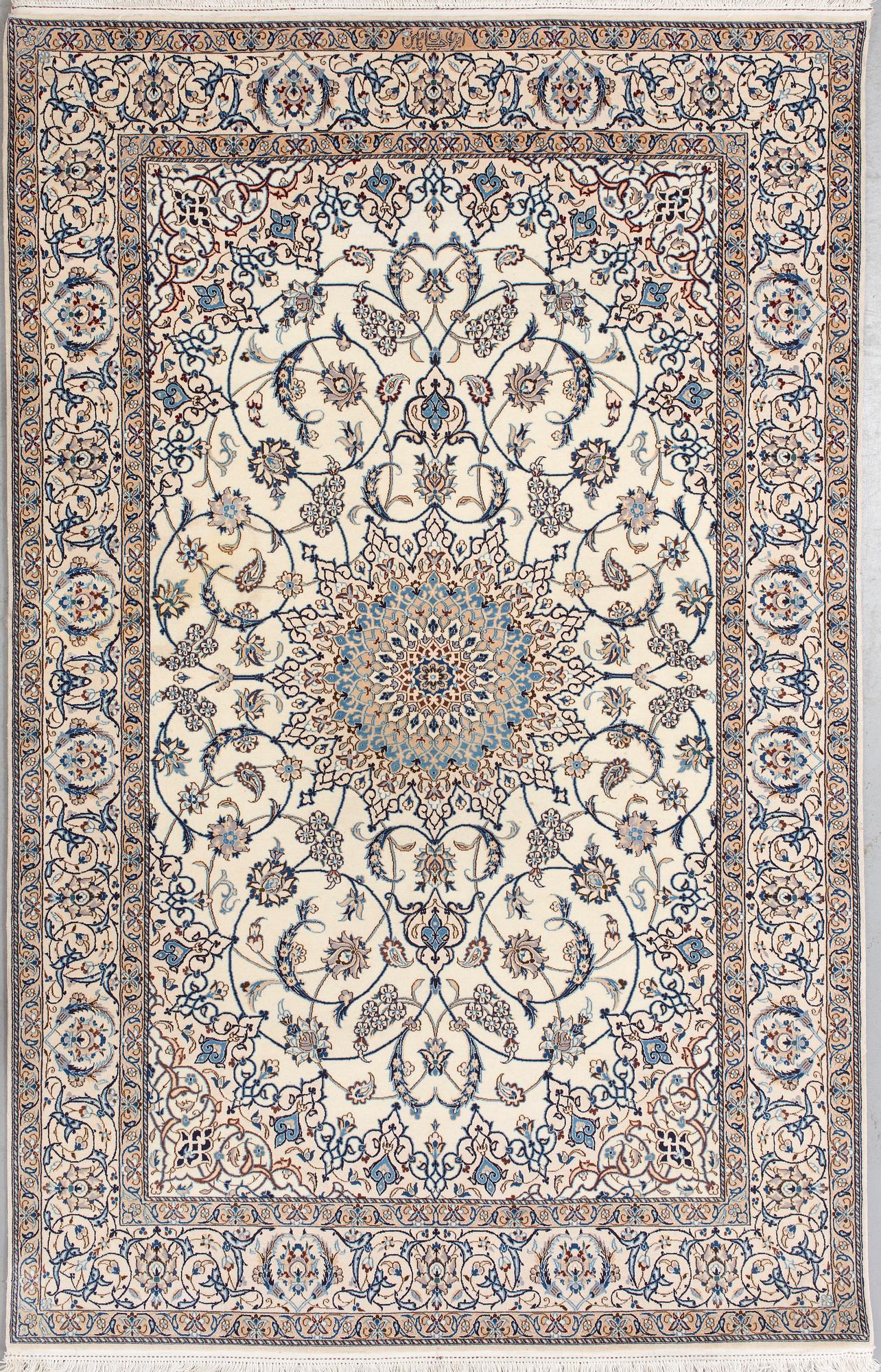 A Nain Habibian rug, part silk. Around 210 x 133 cm.