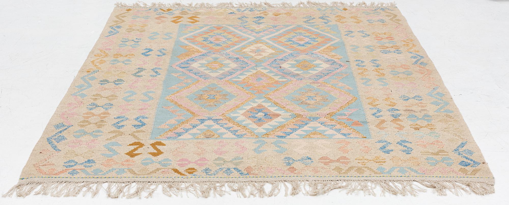 A Kelim carpet, c. 252 x 200 cm.