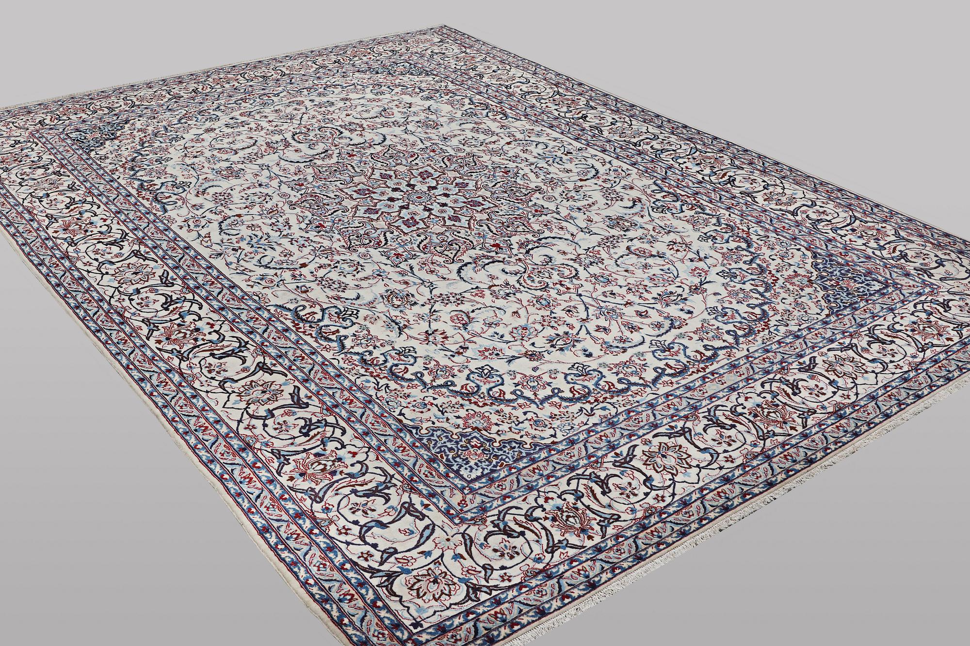 A carpet, Nain, part silk, ca 426 x 309 cm.