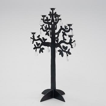 a blackened iron candelabrum, 'Livets träd', by Bertil Vallien for Boda Smide.