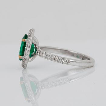 A 1.71-ct Zambian emerald (minor oil) and pavé-set diamond ring. Total carat weight of diamonds 0.65 cts.