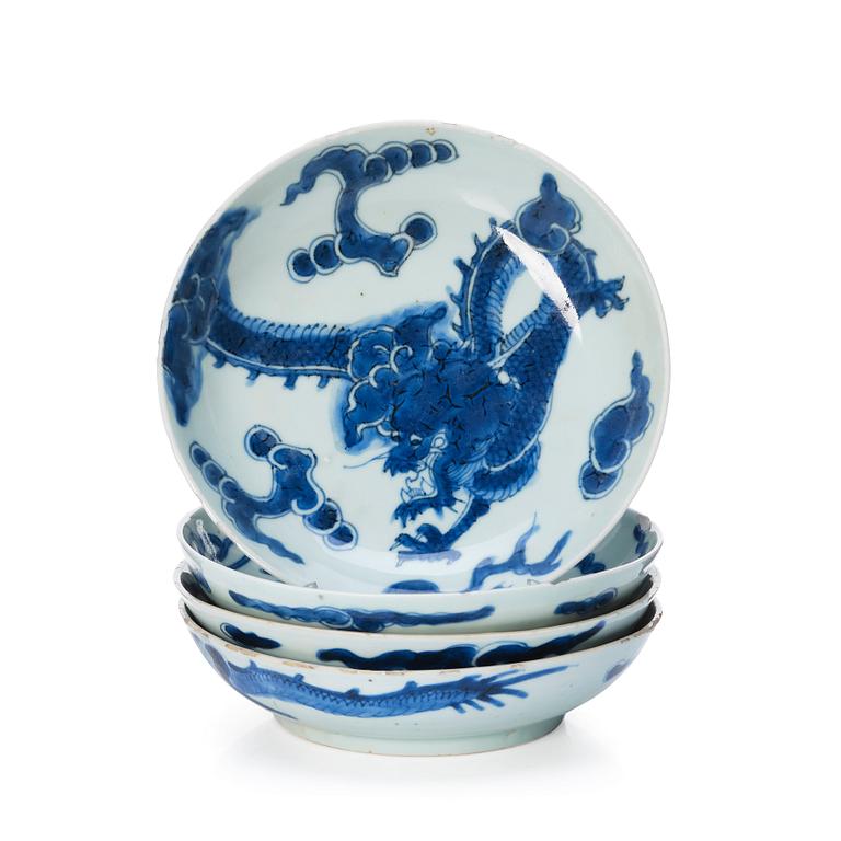 A set of four blue and white dragon dishes, Qing dynasty, 18th Century.