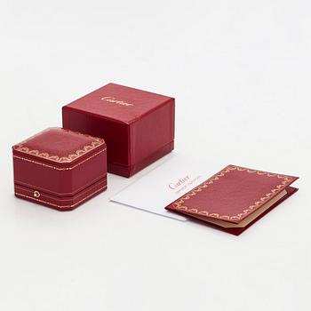 Cartier, an 18K gold 'Love' ring with three brilliant-cut diamonds.