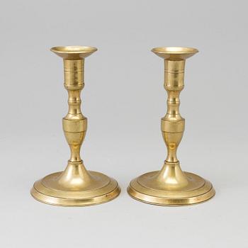 A pair of 19th century bronze candlesticks.