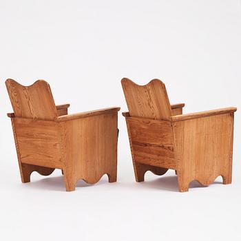 Axel Einar Hjorth, a pair of "Utö" stained pine armchairs, Nordiska Kompaniet 1930s.