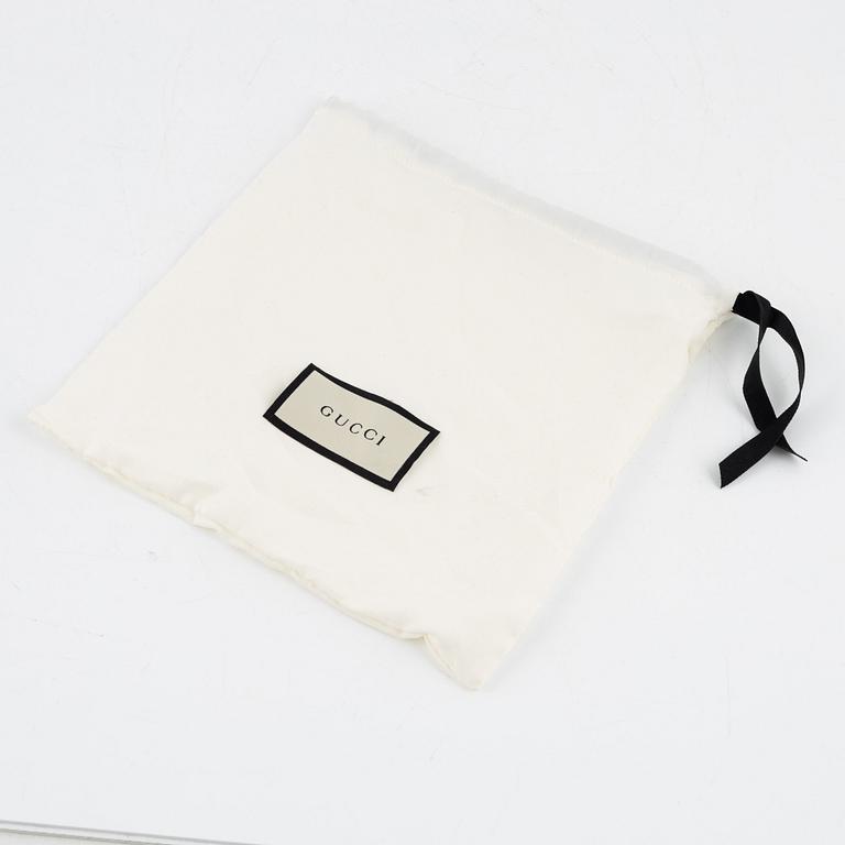 Gucci, a reversible leather belt, size 34.