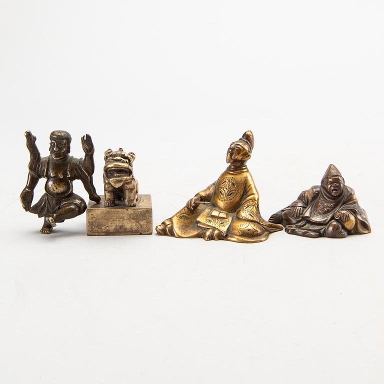 A set of four bronze giurines, a wooden bowl, two stands and one porcelain cup with stand, 20th century.