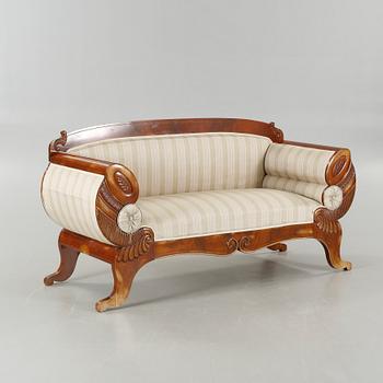 A late Empire sofa from the mid 19th century.