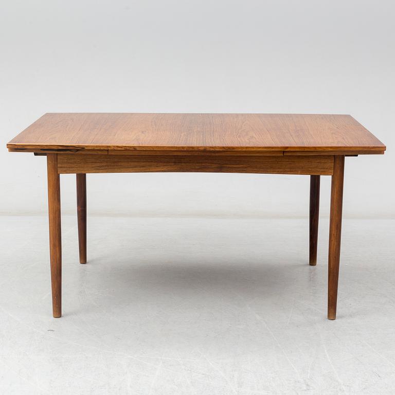 A Danish rosewood dining table, six chairs and a pair of armchairs, 1950's/60's.