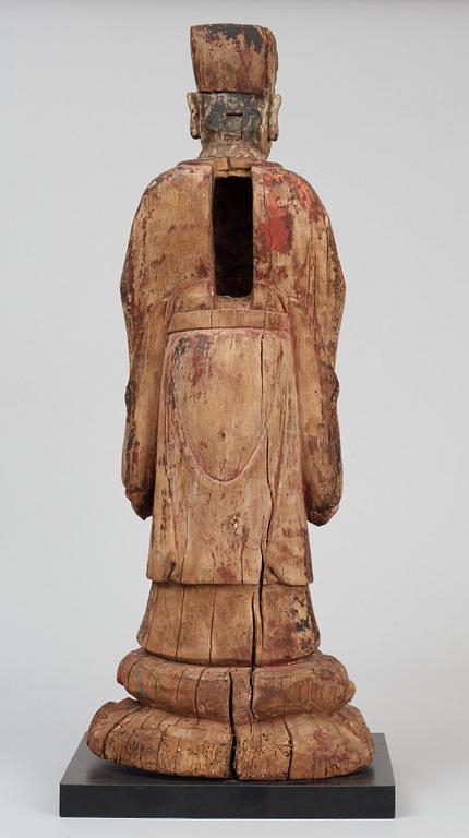 A wooden sculpture of a deity, Ming style.
