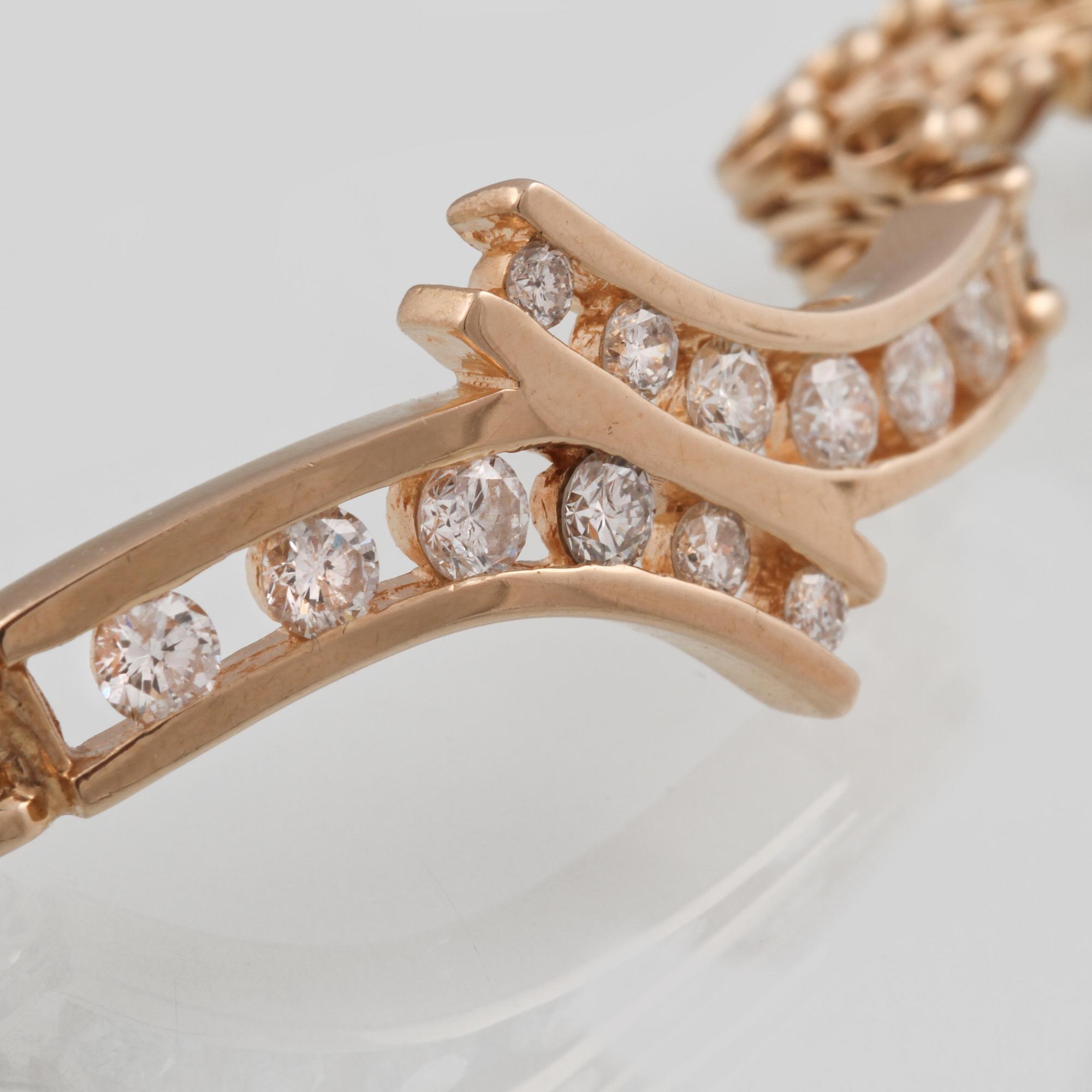 ARMBAND, 18K guld med 10 briljantslipade diamanter ca 2.00 ct. Vikt 11,4 gram.