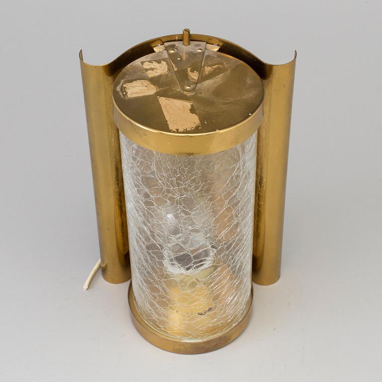 A WALL-LIGHT, brass and glass, probably 1970s.